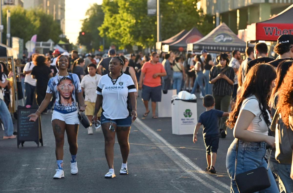 Thousands descend on Fulton Street where food, clothing and other vendors have helped ArtHop grow beyond art exhibits. Photographed Thursday, Aug. 3, 2023.