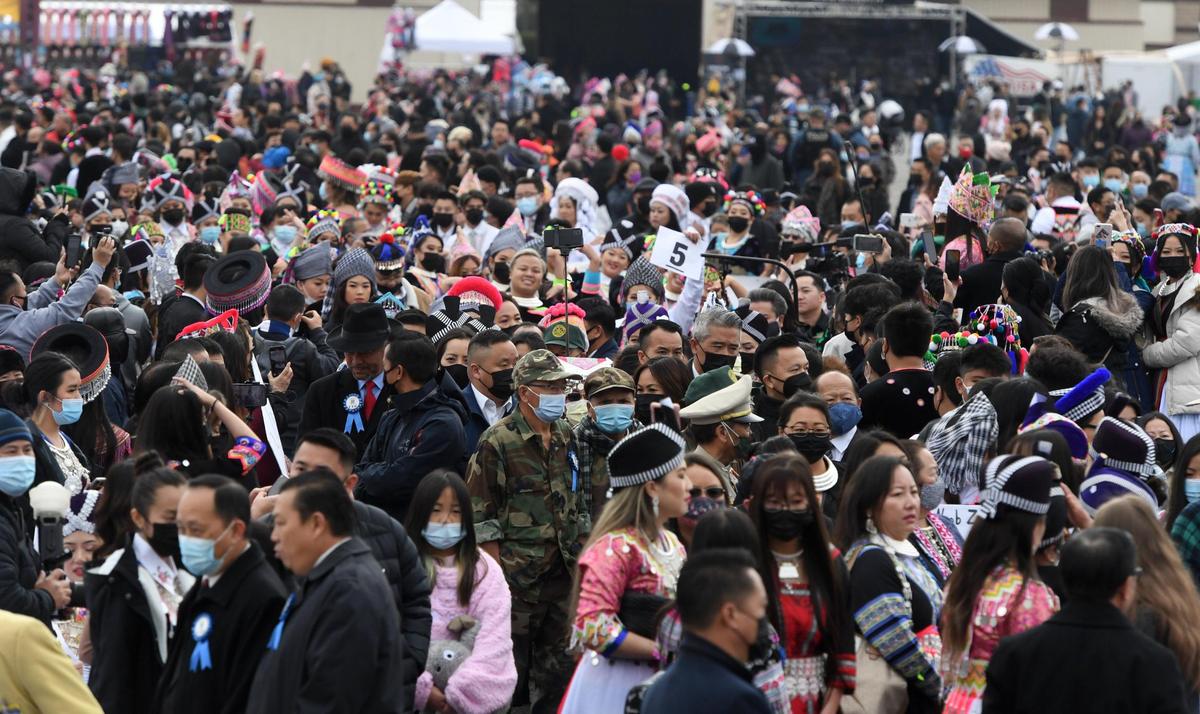 Crowds assemble towards the main stage during the Hmong New Year celebration at the Fresno Fairgrounds, Thursday morning, December 30, 2021.