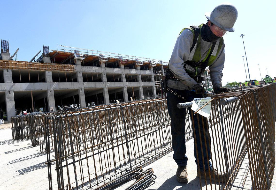 Ironworker Ian Yount assembles rebar beams during during construction of the Fresno Yosemite International Airport four-story garage, April 14, 2021.