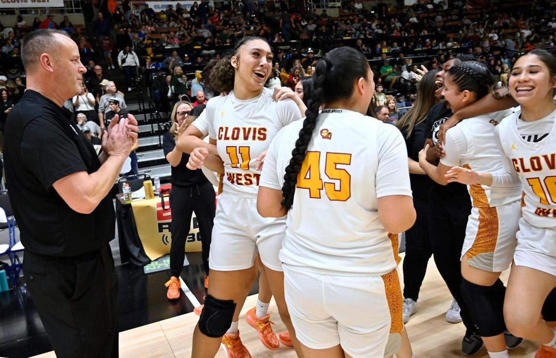 Clovis West celebrates its 45-41 win over St. Joseph in the Division I basketball championship Saturday, Feb. 24, 2024 at Selland Arena in Fresno.