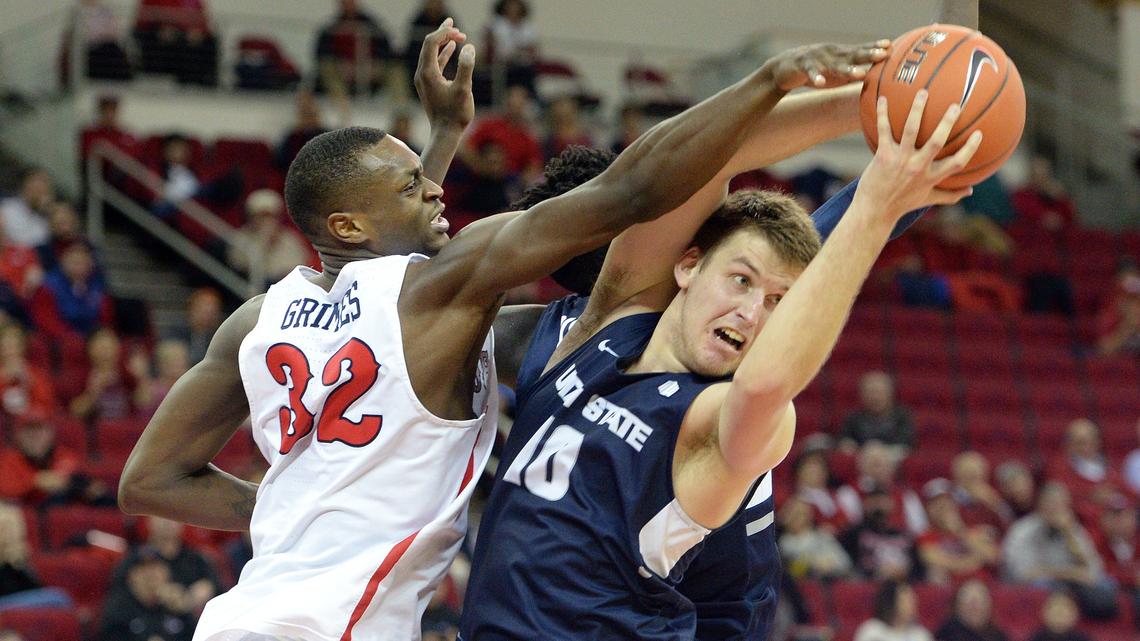 Fresno State’s Nate Grimes, left, reaches for a rebound snagged away by Utah State’s Quinn Taylor during the Bulldogs’ 82-81 loss to the Aggies at the Save Mart Center in Fresno on Tuesday, Feb. 5, 2019.