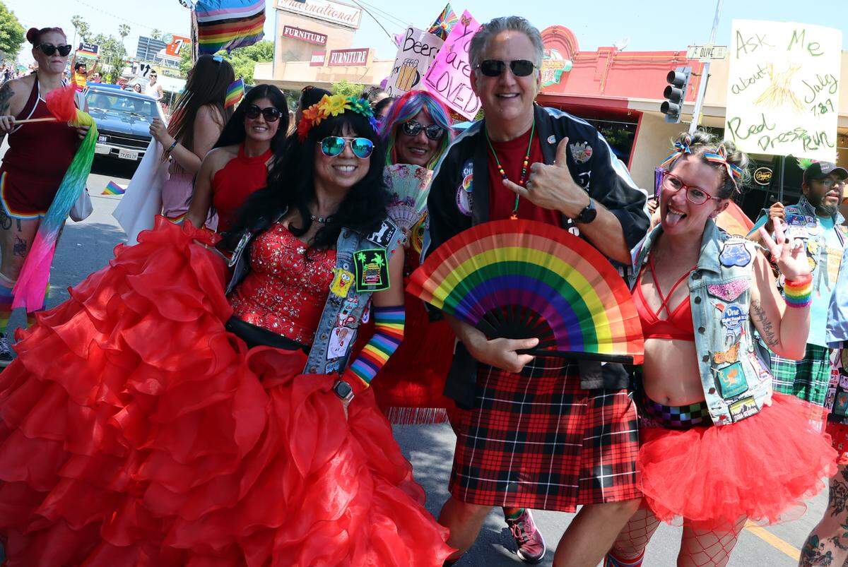 Members of the Coyote Ugly Hash Harriers celebrate during the Fresno Rainbow Pride Parade in the Tower District on June 3, 2023.
