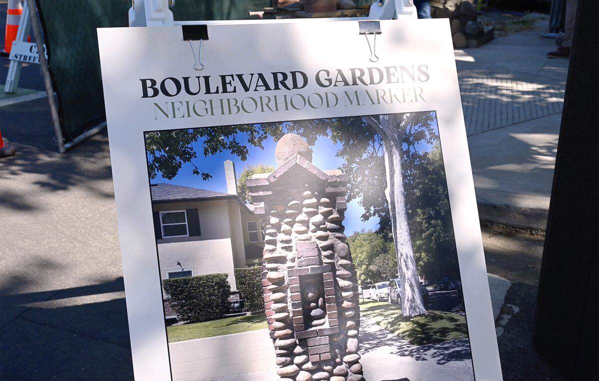 A photographs shows the original historical pillar at SImpson and Palm avenues before it was destroyed by a drunk driver last December, seen during an event held Tuesday, May 19, 2026 in Fresno. Fresno Mayor Jerry Dyer led an event for the restoration of the monument.