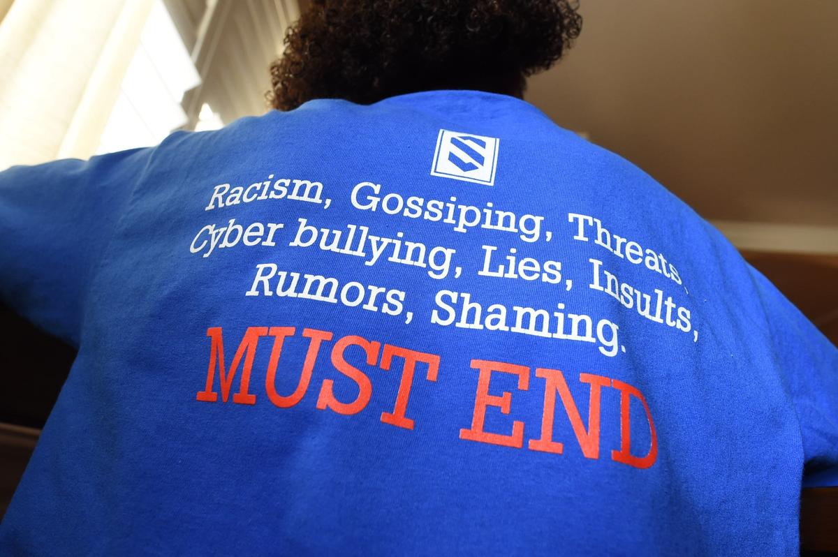 Tarrick Walker, 12, wears a T-shirt designed by his father, Marcel Walker, to address the issue of bullying after he was called the “N-word” recently on the playground of his Hanford school.