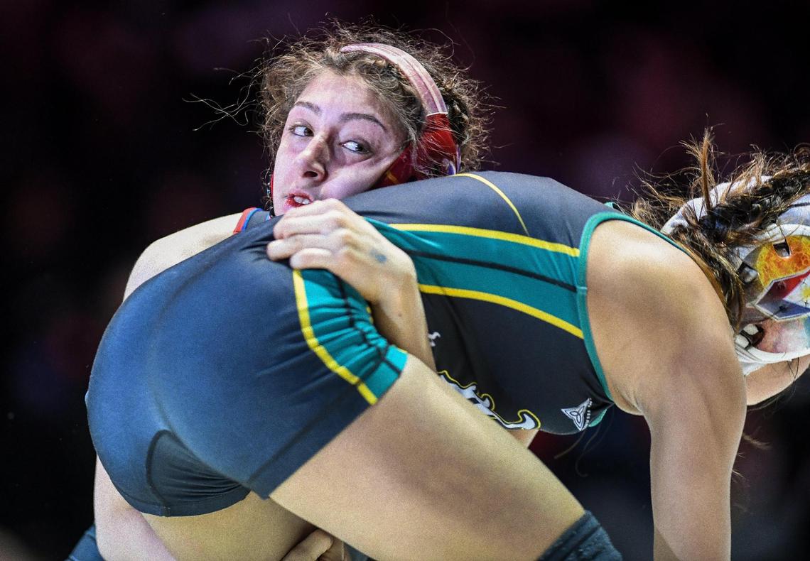 Buchanan’s Brenda Nunez, top, wrestles Jillian Wells in the girls 101-pound CIF State Wrestling Championship match at Mechanics Bank Arena in Bakersfield on Saturday, Feb. 25, 2023. Nunez defeated Wells for the championship.