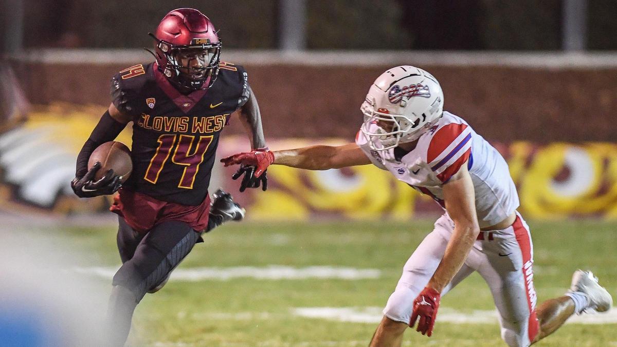 Clovis West’s Landon Wright, left, tries to turn the corner as Buchanan’s McKay Jones tracks him down during their game at Lamonica Stadium in Clovis on Friday, Sept. 30, 2022.