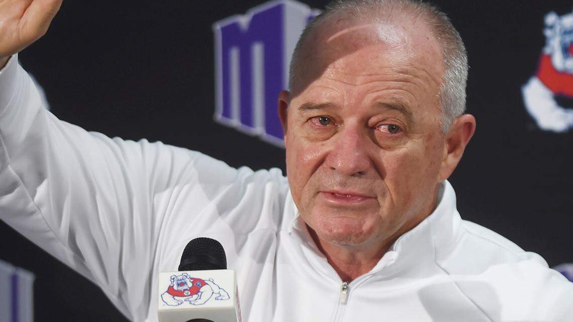 Citing health concerns, a teary-eyed Jeff Tedford waves goodbye to media and supporters after announcing his resignation as Fresno State’s head football coach at a press conference at Fresno State Friday morning, Dec. 6, 2019 in Fresno. Tedford led the Bulldogs to 10-4 and 12-2 records with a a Mountain Conference championship and bowl victories in his first two seasons before going 4-8 this season.