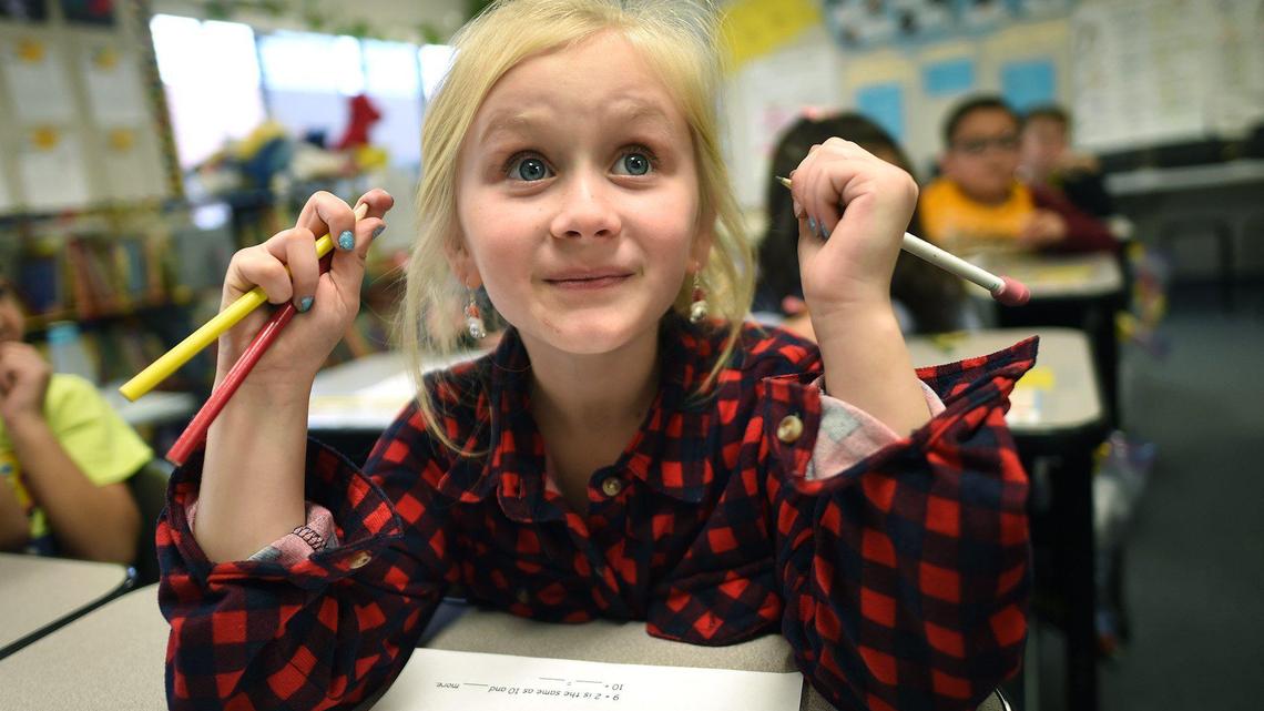 Temperance Kutner Elementary first grader Haylee Huxtable follows her teacher’s lesson in a portable classroom- one of many that were brought in to accommodate the growing school. Measure A Bond would add more portables.