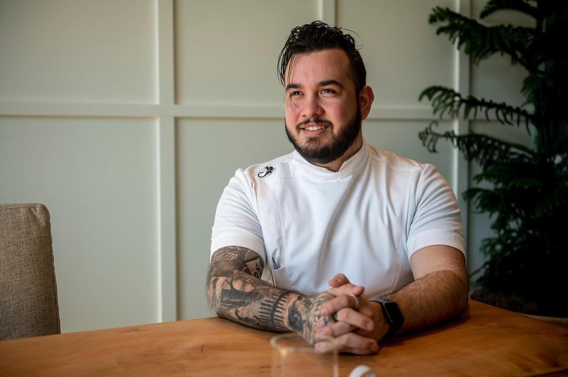 Rainbird executive chef Quentin Garcia speaks about some of the restaurant’s dishes inside the El Capitan Hotel located at 609 W. Main Street in Merced, Calif., on Thursday, Feb. 3, 2022. The restaurant will offer a sweet potato dessert consisting of a sweet potato cooked in coffee butter before being grilled and served with black apple caramel, fermented blueberries and topped with pistachio gelato. The restaurant is scheduled to open Feb. 11.