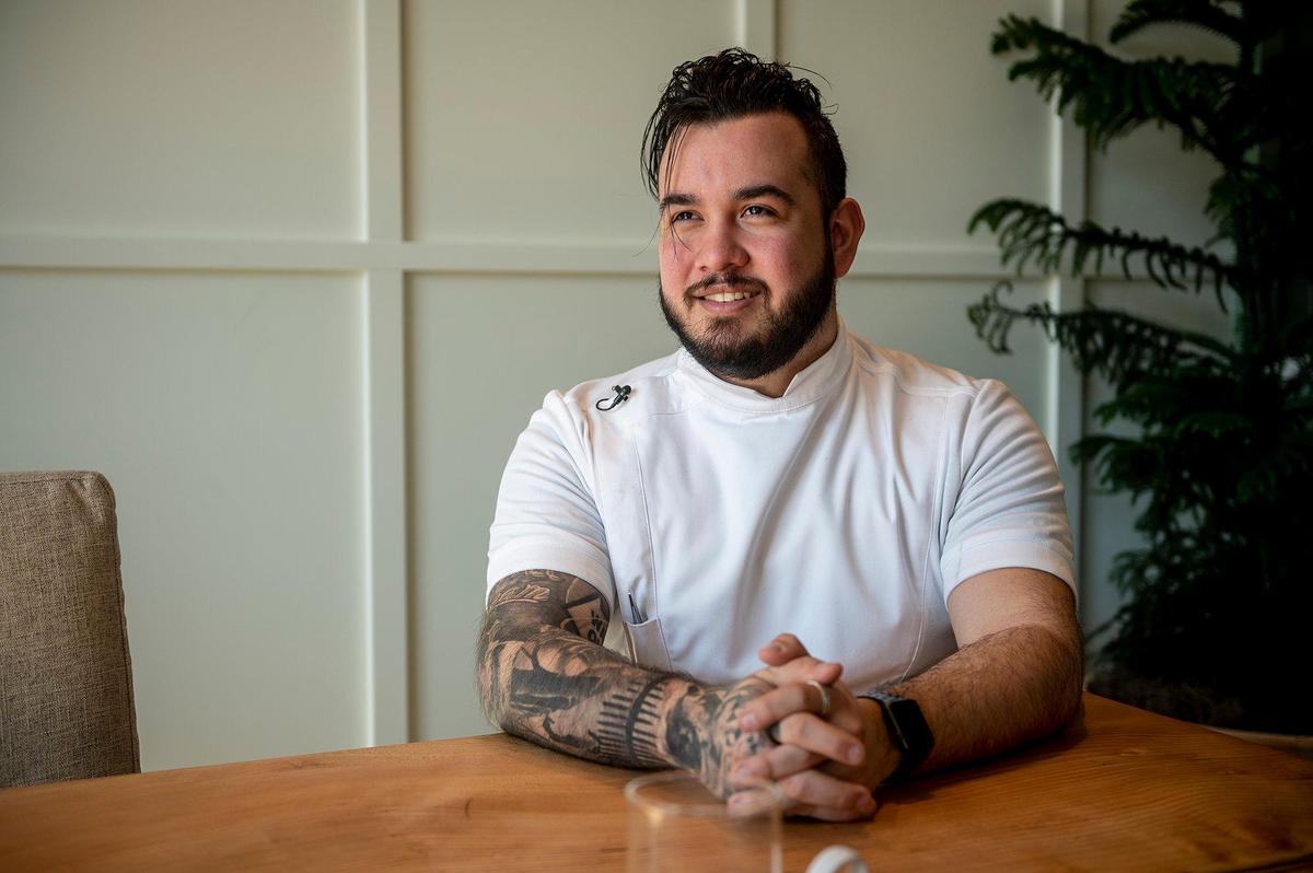 Rainbird executive chef Quentin Garcia speaks about some of the restaurant’s dishes inside the El Capitan Hotel located at 609 W. Main Street in Merced, Calif., on Thursday, Feb. 3, 2022. The restaurant will offer a sweet potato dessert consisting of a sweet potato cooked in coffee butter before being grilled and served with black apple caramel, fermented blueberries and topped with pistachio gelato. The restaurant is scheduled to open Feb. 11.