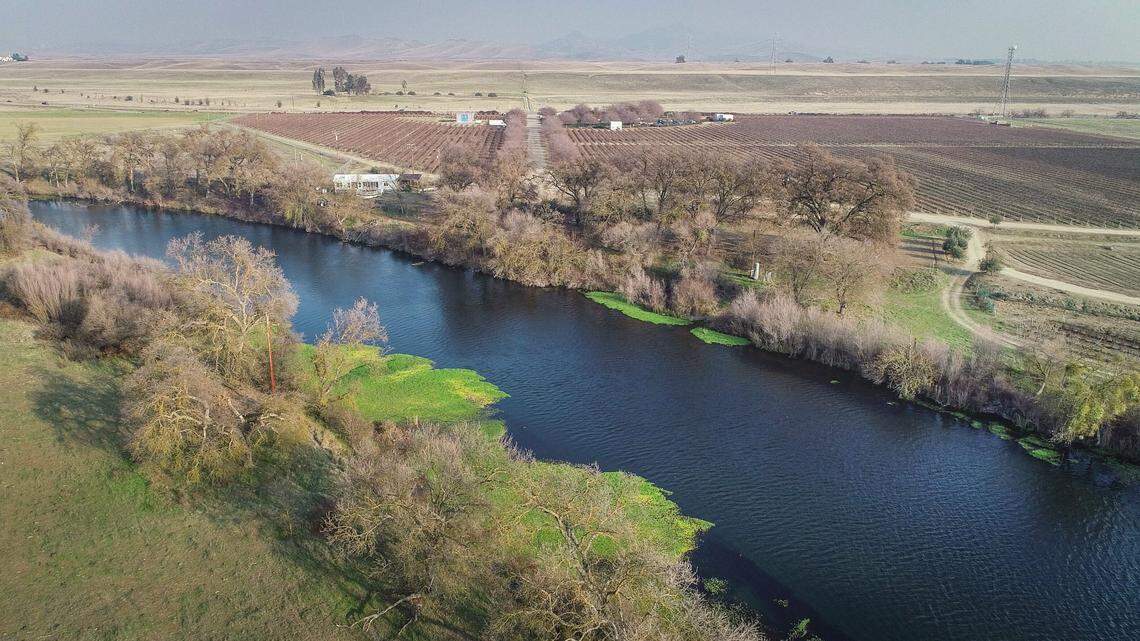 The San Joaquin River curves along land formerly owned by Sumner Peck Ranch, top, as seen in this drone image on Thursday, Jan. 7, 2021. The ranch was recently acquired by the San Joaquin River Parkway and Conservation Trust with long-term plans to restore the site to wildlife habitat with a natural surface trail system.