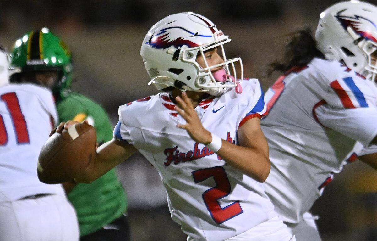 Firebaugh quarterback Leonardo Perez prepares to throw against Roosevelt at Sunnyside's stadium Friday, Sept. 12, 2025 in Fresno. The Rough Riders pummeled the Eagles 46-6 with Firebaugh scoring their only touchdown in the final minutes of the game.