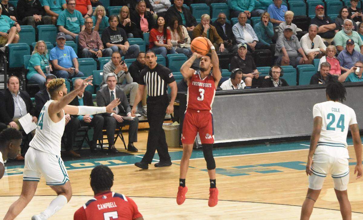 Fresno State point guard Isaiah Hill gets an open shot in the Bulldogs’ 85-74 victory over Coastal Carolina in the championship game of The Basketball Classic.