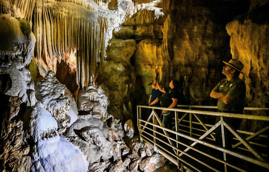 Visitors get an early look at calcium carbonate formations in Crystal Cave’s Organ Room within Sequoia National Park as the cave officially reopens to the public following years of closures due to COVID, fires and floods.