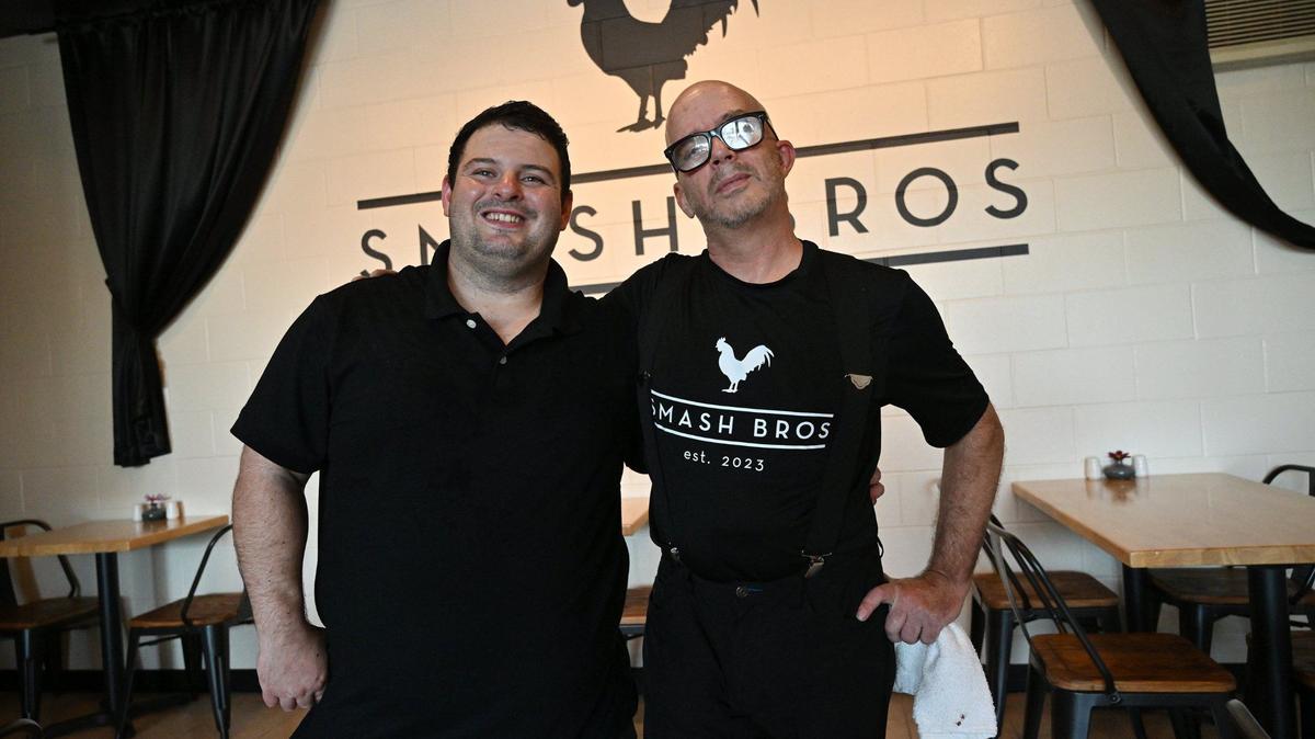 Chefs Jonathan Aviles, left, and Matthew Simons, right, have opened Smash Bros Bistro at Fresno Street and Bullard Avenue, serving up food beyond simply smashburgers. 