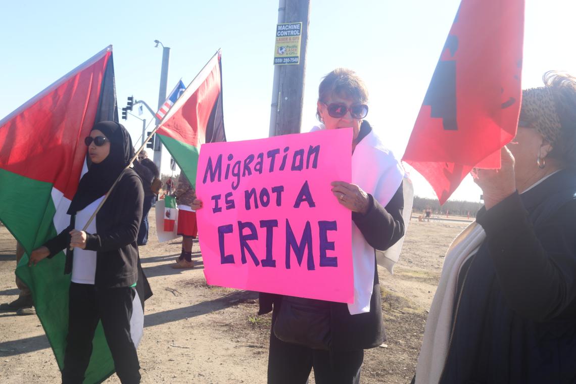 A couple of dozen people holding banners that read ‘Migration is not a crime” showed up to support immigrant farmworkers at the corner of South Laspina Street and East Paige Avenue as Ag show attendees drove by to the annual World Ag Expo on Tuesday, Feb. 11, 2025.