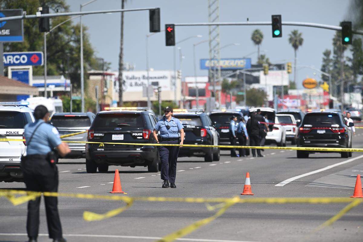 Blackstone Avenue between Dakota and Shields avenues is narrowed to one lane after an officer-involved shooting in Fresno, California on Thursday, April 10, 2025.