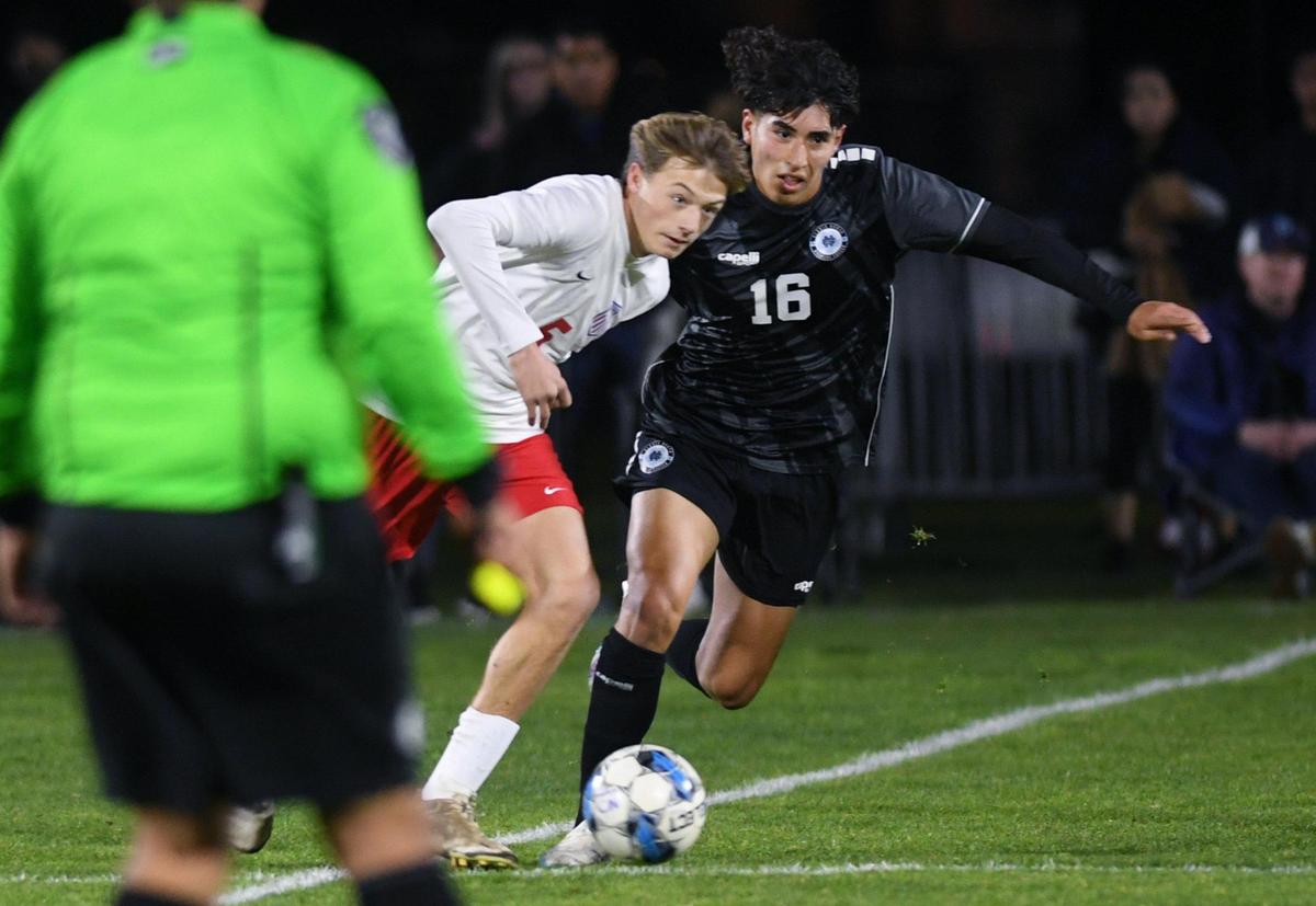Buchanan’s Beau Brusseau, left, and Clovis North’s Brandon Lopez, right, in a Tri-River Athletic Conference soccer match Thursday, Feb. 9, 2023 in Fresno.