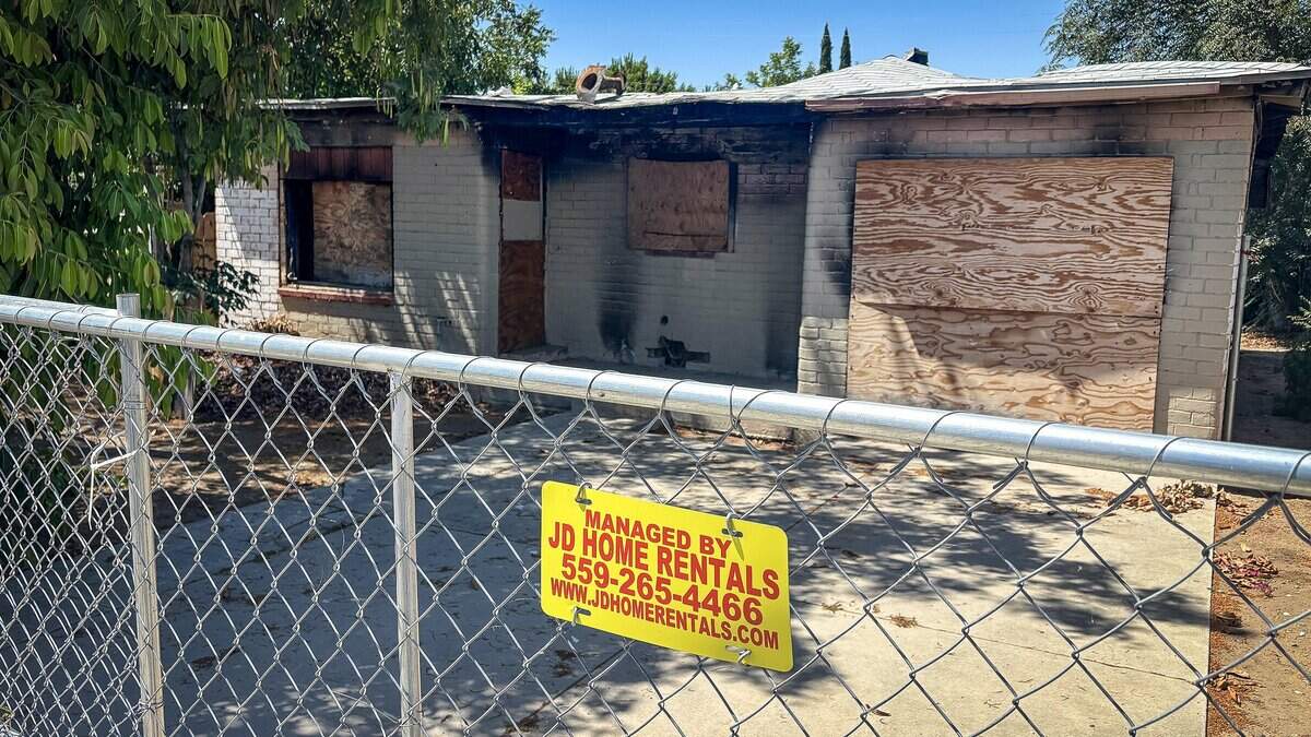 A shuttered Fresno home, apparently burned in a fire, that is managed by JD Home Rentals is shown on Monday, June 15, 2026. JD Home Rentals, one of Fresno's largest landlord companies, has filed at least seven lawsuits against the City of Fresno this year. The company is arguing in court documents that code enforcement officers sometimes accessed its properties without consent when they filed citations.