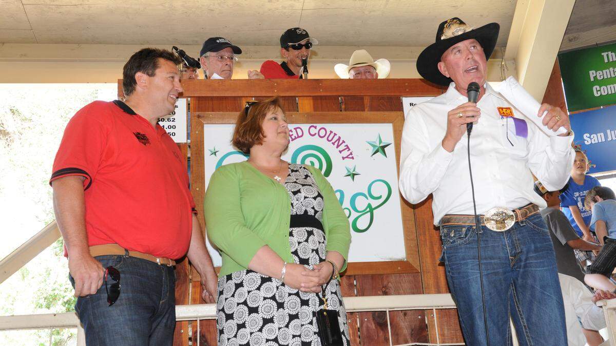 Gregg Hostetler announces the creation of a $1 million endowment to benefit the Merced County Fairs in the name of his late wife Cathie. Looking on are his daughter Andrea Brandt and her husband and Spring Fair Manager Ron Brandt on May 4, 2013.