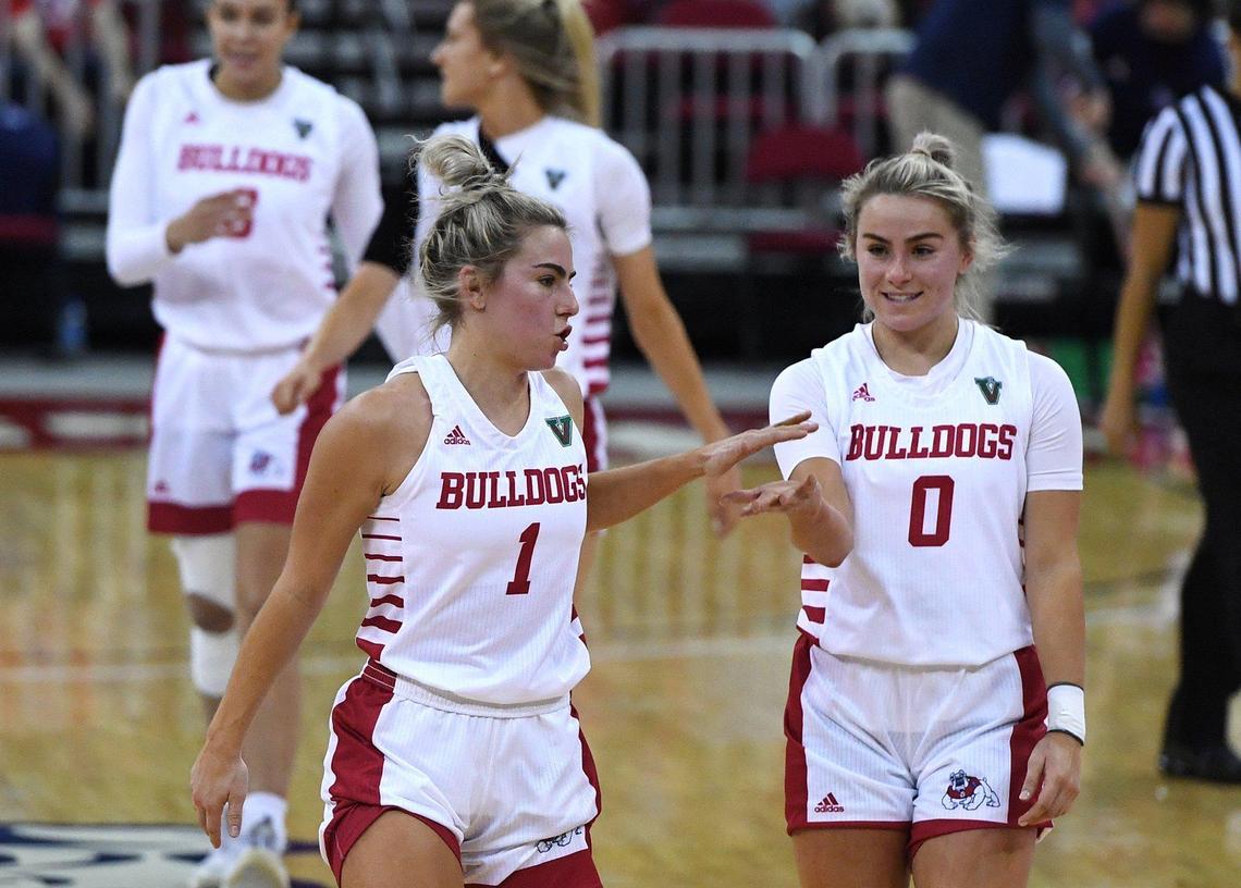 Fresno State’s Haley Cavinder, left, with Hanna Cavinder, right, helped the Bulldogs complete a sweep of Boise State Saturday afternoon, Jan. 23, 2021, with a 67-64 win.