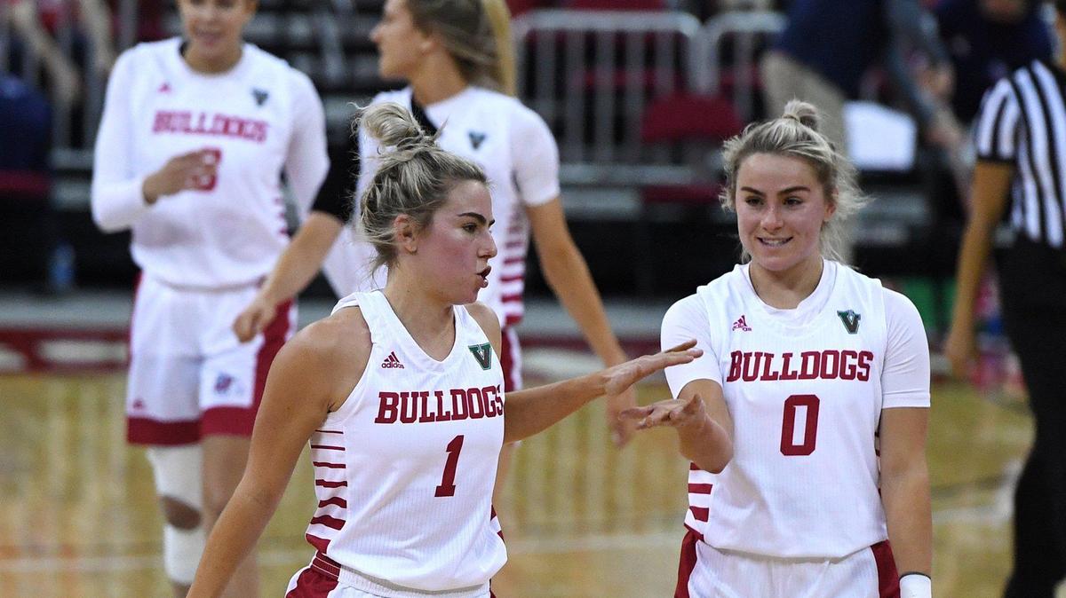Fresno State’s Haley Cavinder, left, with Hanna Cavinder, right, celebrate during the game against Boise State on Saturday afternoon, Jan. 23, 2021 in Fresno. The Bulldogs went on to win 67-64.