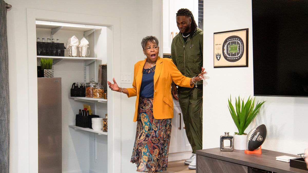 Las Vegas Raiders All-Pro wide receiver Davante Adams trades his football for a sledgehammer as he gifts his grandmother, Bettie, who helped raise him, a modern upgrade to her East Palo Alto, Calif., home where he grew up.