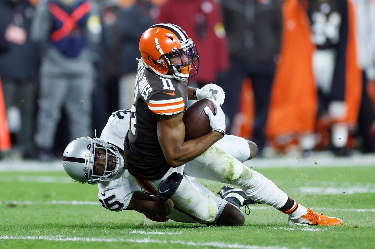Las Vegas Raiders cornerback Brandon Facyson tackles Cleveland Browns wide receiver Donovan Peoples-Jones during the second half of an NFL game, Monday, Dec. 20, 2021, in Cleveland.