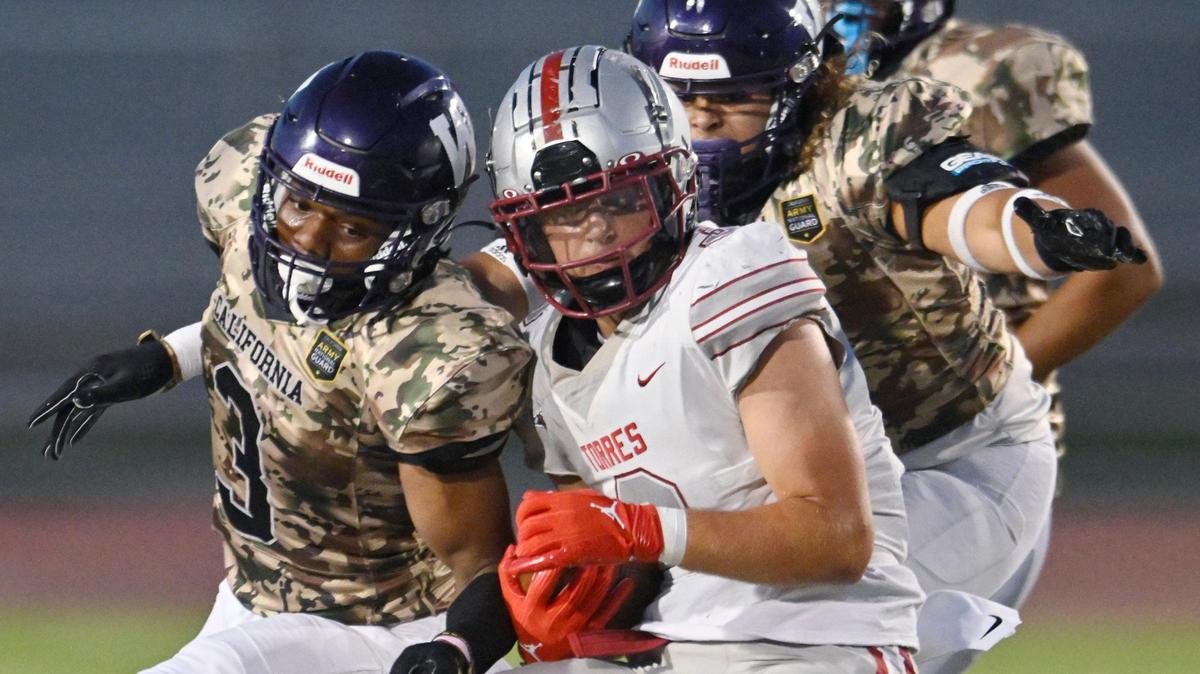 In a file photo, Torres High’s Joseph Bass spins away from the Washington Union defense on a run Friday, Sept. 1, 2023 in Easton. Bass helped the Toros to a 39-14 victory over McLane on Thursday, Sept. 21, 2023 when he scored a touchdown.