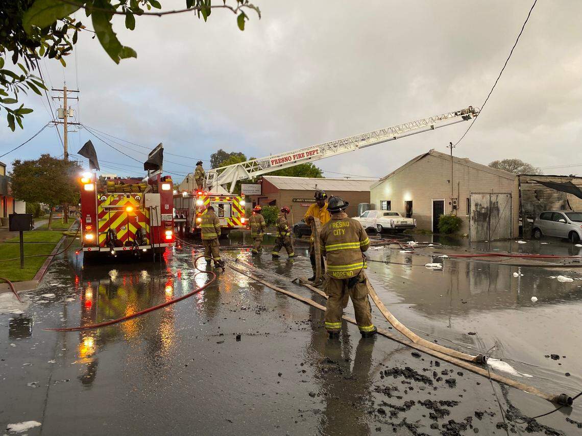 Fresno Fire Department cleans up after a fire destroyed a commercial building about 4:30 a.m. Friday, March 22, 2022, according to firefighters.