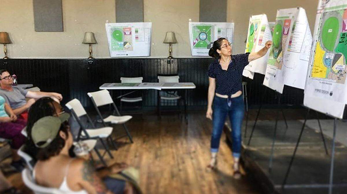 Different designs for a potential Broadway Parque are displayed at a community meeting.