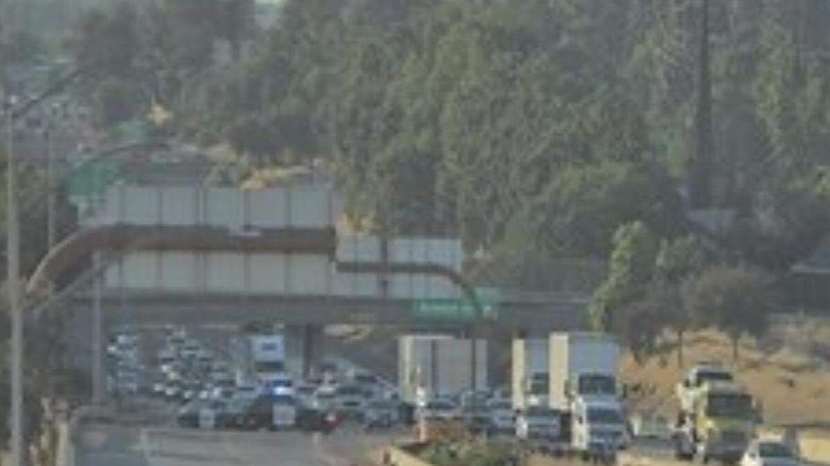 Traffic came to a stop on Highway 99 past Belmont after a CHP officer was injured in a crash near the transition to Highway 180 on Thursday, May 7, 2026.