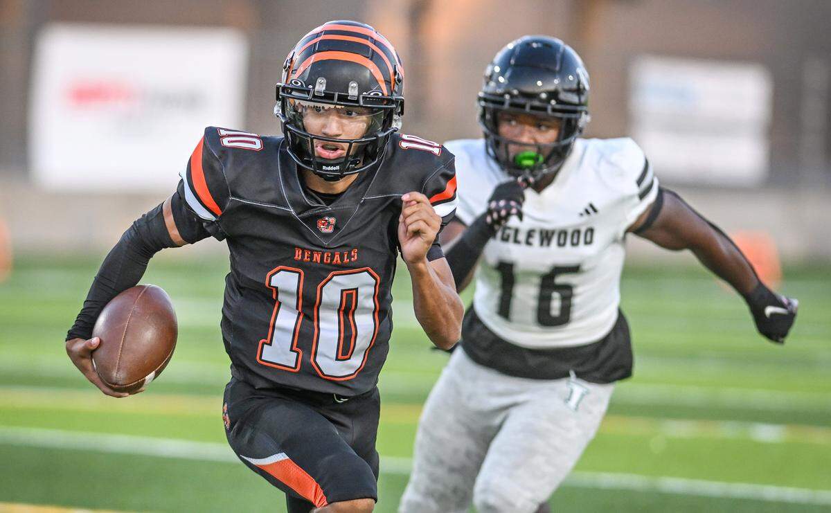 Central East quarterback Jelani Dippel scrambles for yards around the end during their game against Inglewood at Koligian Stadium on Friday, Aug. 22, 2025.