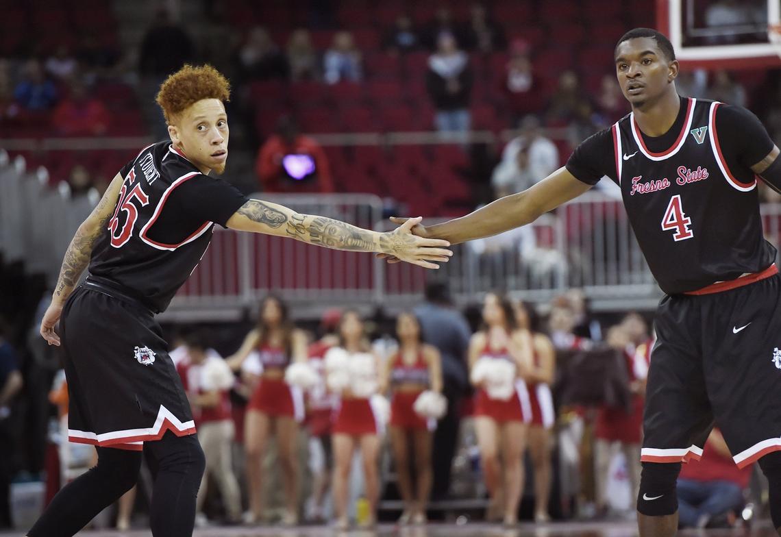 Fresno State’s Noah Blackwell, left, and Braxton Huggins, right, shake hands after a play in a 71-60 victory over Wyoming Wednesday, Feb. 27, 2019 in Fresno.