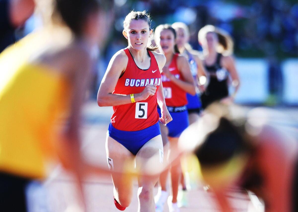 Buchanan’s Grace Hutchison, center, places 6th and Sierra Cornett, background, places 7th in the Girls 1600m Run at the CIF State Track and Field Championship finals Saturday, May 28, 2022 in Clovis.