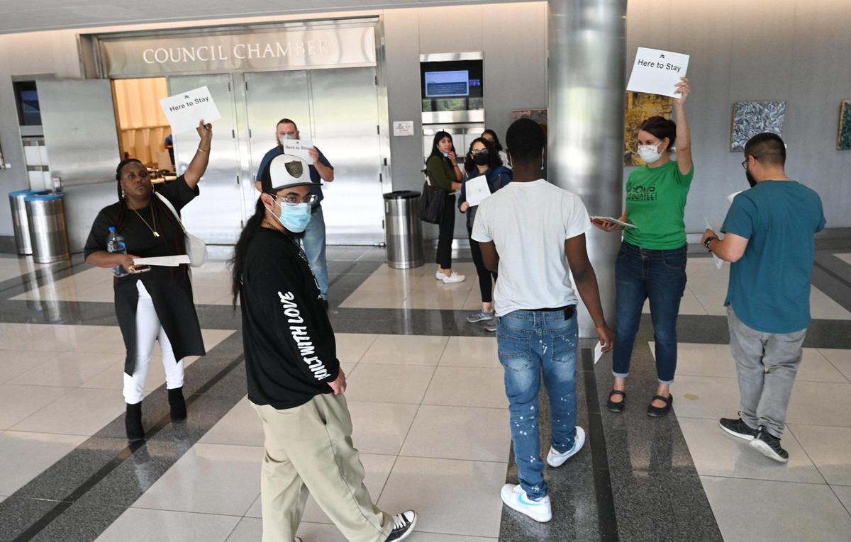 Protesters unhappy with the city’s housing plans gather outside Fresno City Council chambers, leaving their seats in protest just as presentations before the city council began Wednesday, April 27, 2022 in Fresno.