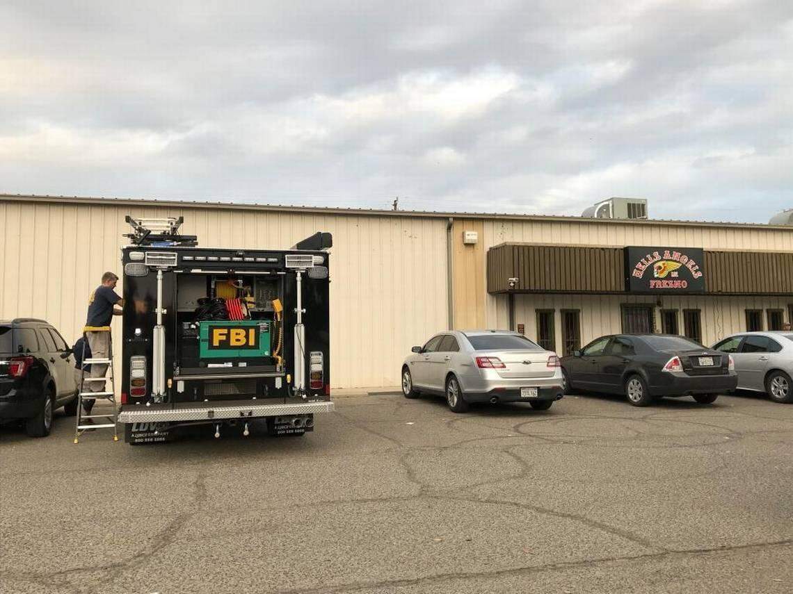 FBI agents search for evidence at the Hells Angels clubhouse on South G Street after a federal indictment against the outlaw club was issued in 2017.