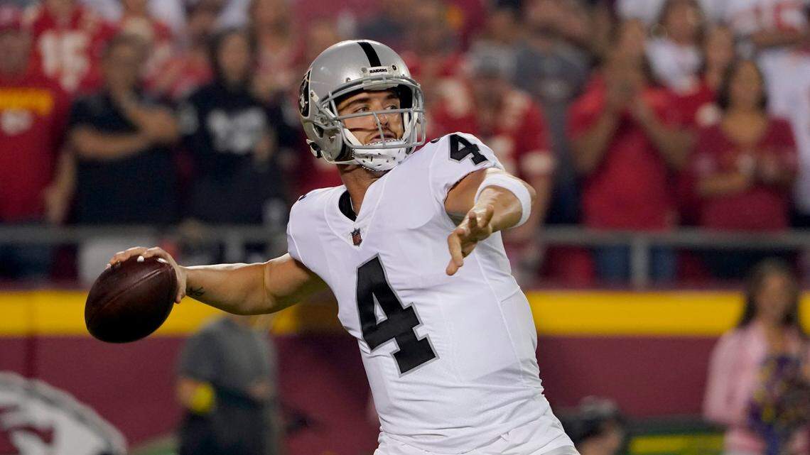 Las Vegas Raiders quarterback Derek Carr throws during the first half of an NFL football game against the Kansas City Chiefs Monday, Oct. 10, 2022, in Kansas City, Mo.