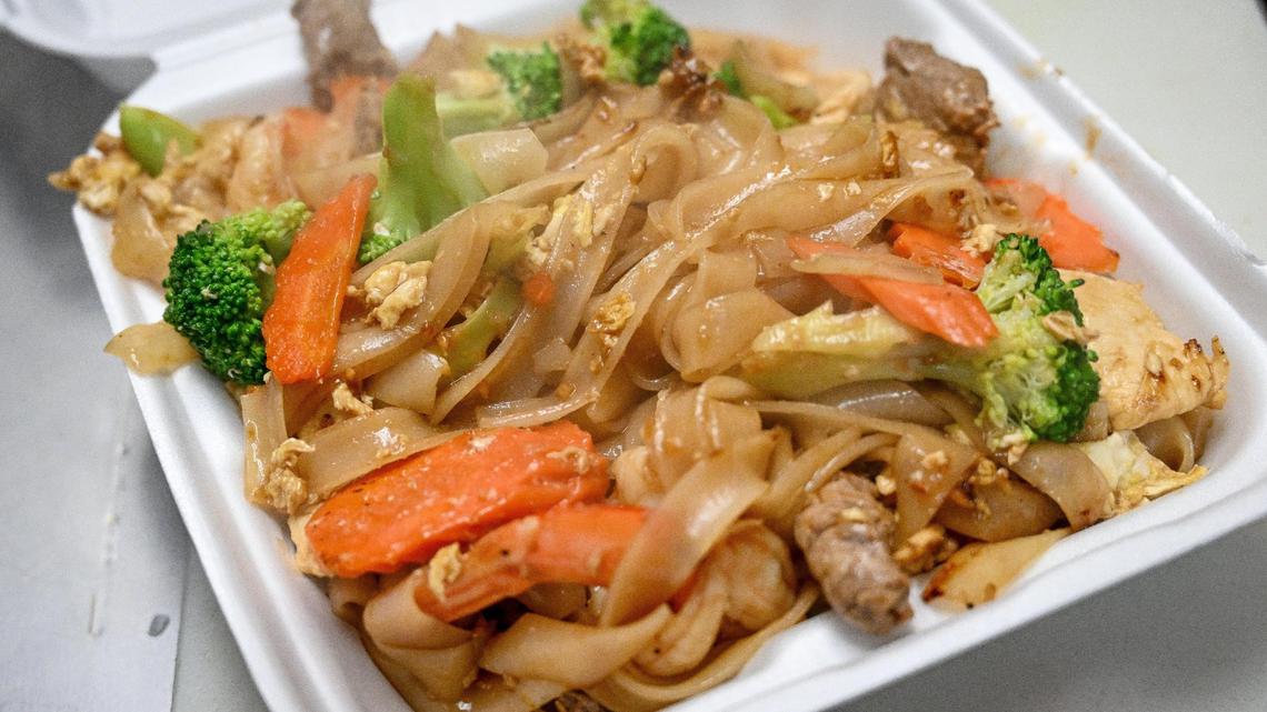 A pad se-ew combo plate is prepared for a customer during the soft opening of Love & Thai in the shopping center at South Chestnut and East Butler avenues in southeast Fresno on Wednesday, Oct. 3, 2023.