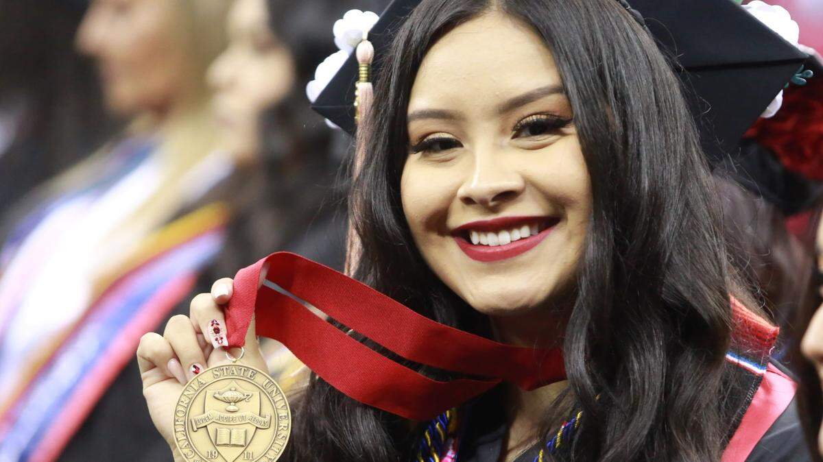 Fresno State’s Karina Ortega during the College of Health and Human graduation ceremony Saturday (May 21) morning at the Save Mart Center. Ortega was selected as the 2022 undergraduate dean’s medalist for the College of Health and Human . She earned her bachelor’s degree in social work with a 4.0 GPA.