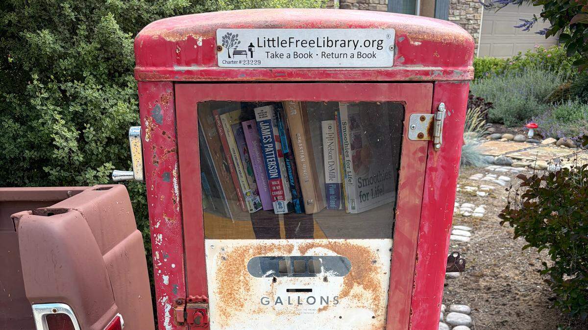 A three-story bright red locker at the corner of Swift and McKelvy serves as a Little Free Library run by Clovis natives Kimberly and John Schaefer.