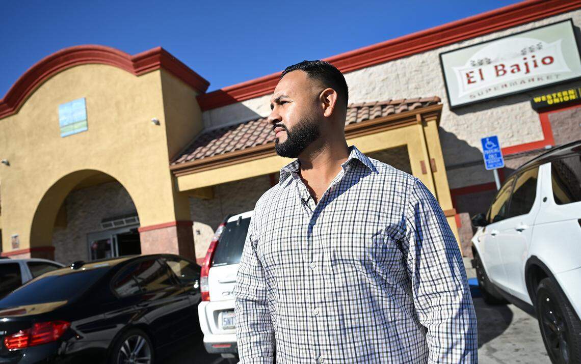 Fernando Rodriguez, pictured, said his family has invested millions to relocate their business El Bajio Supermarket, background, but now the California High Speed Rail Authority has proposed skirting the city altogether. Photographed Friday, Nov. 7, 2025 in Merced.
