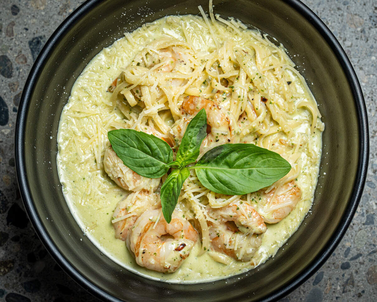 New to the menu at The Standard, the shrimp linguine has shrimp sauteed in a sun-dried tomato butter with Parmesan and pesto.