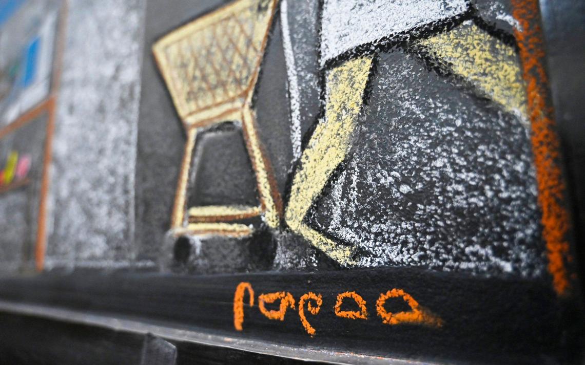 Scott Bolter, better known as Scott In Meat, included his signature in ancient Egyptian hieroglyphics on the chalk art he created at WinCo Foods in Clovis where he also works in the meat department.