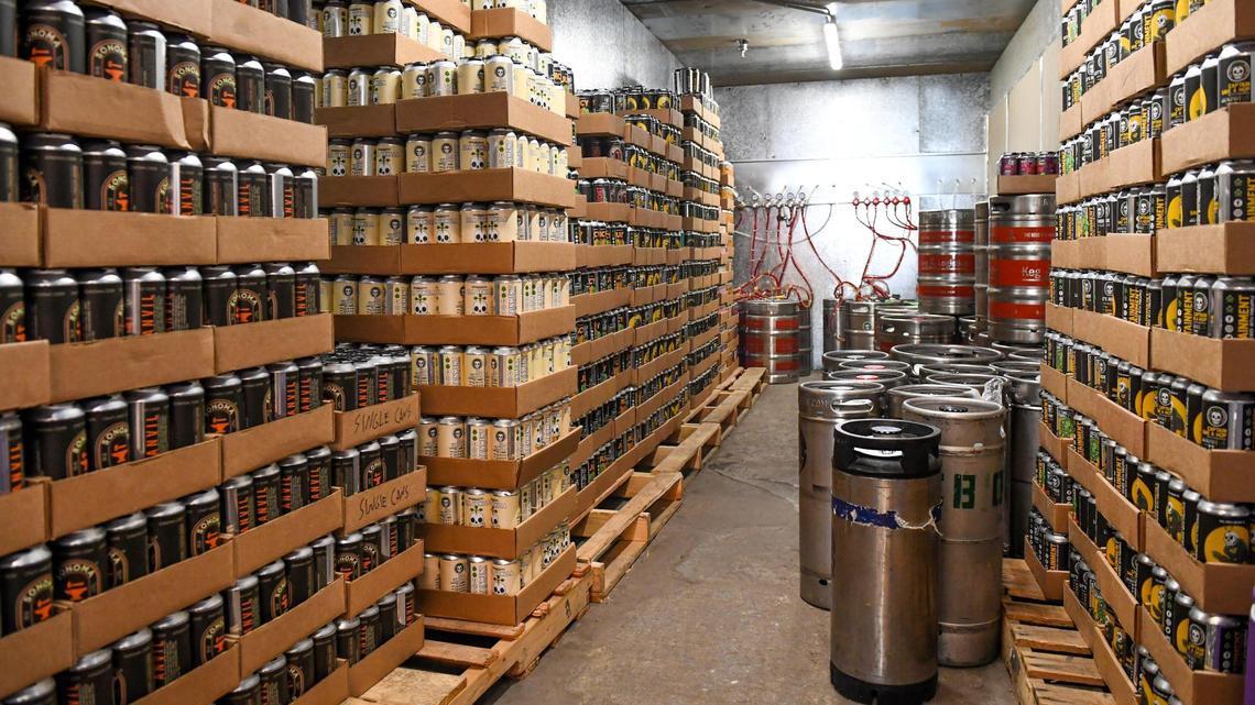 Kegs and cases of beer await customers in the cold storage at Full Circle Brewing which will be opening in the former Zack’s Brewing in downtown Fresno.