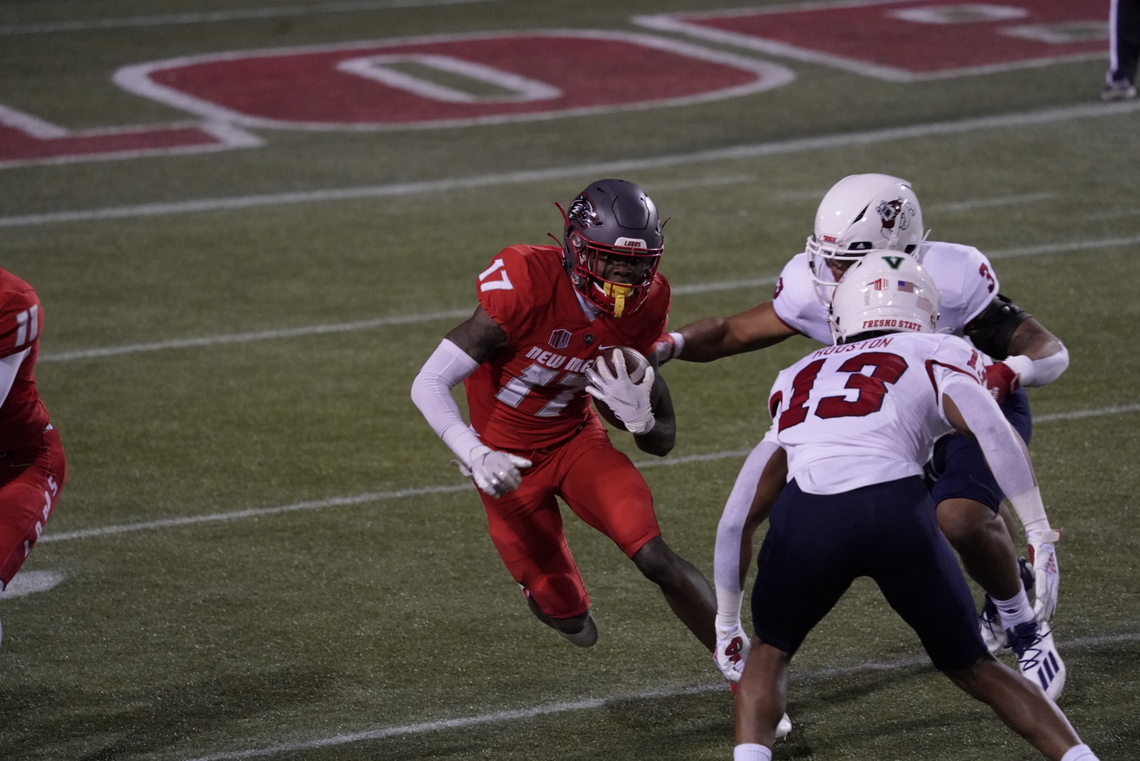 Fresno State linebacker Justin Houston (13) lines up a tackle on New Mexico wideout Emmanuel Logan-Greene in the Bulldogs’ season-ending 49-39 loss Saturday at Sam Boyd Stadium in Las Vegas. Houston led the Bulldogs with 11 tackles including 1.5 tackles for loss.