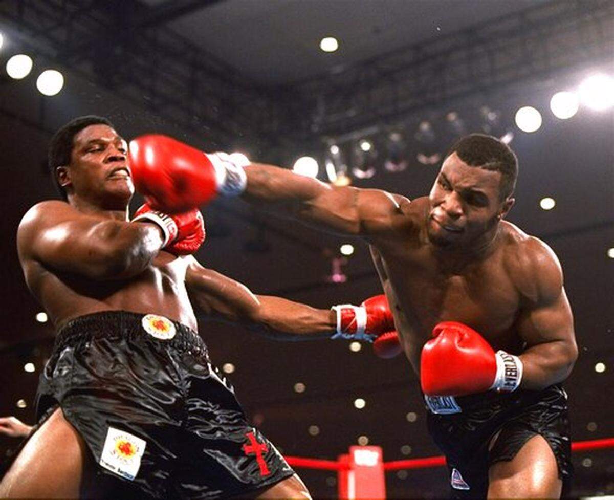 In this Nov. 22, 1986, file photo, Mike Tyson, right, delivers a blow to Trevor Berbick during a boxing bout in Las Vegas.