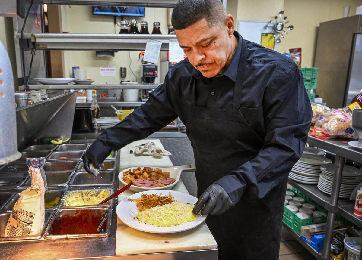 Armando Martinez prepares omelets and eggs Benedicts his restaurant Jeb’s Blueberry Hill in the historic Hoblitt Hotel in Old Town Clovis.