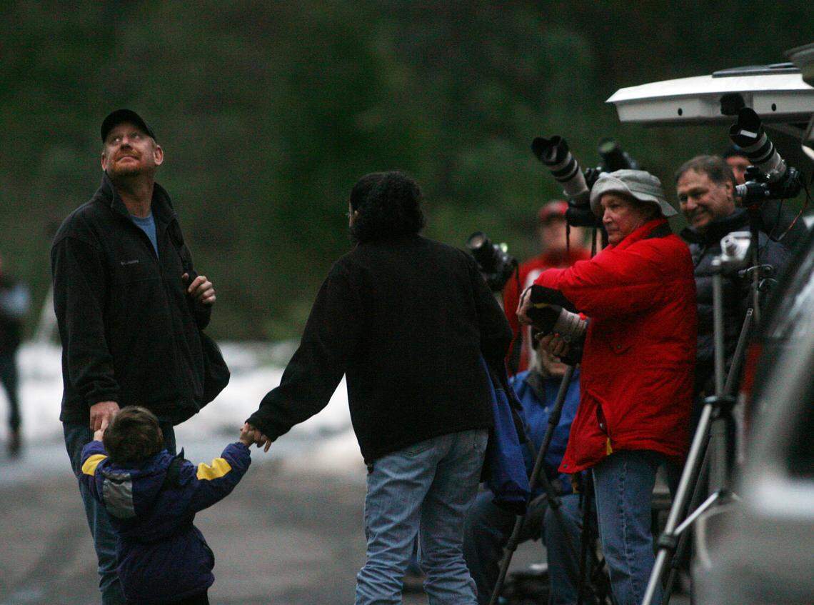 Marc Howard, left, glances one last time at Horsetail Fall in Yosemite Valley before he leaves the group of photographers with his wife Tanya Hopkins and their son Max Howard, 3, all of Sacramento, in February 2009 in Yosemite Valley. 