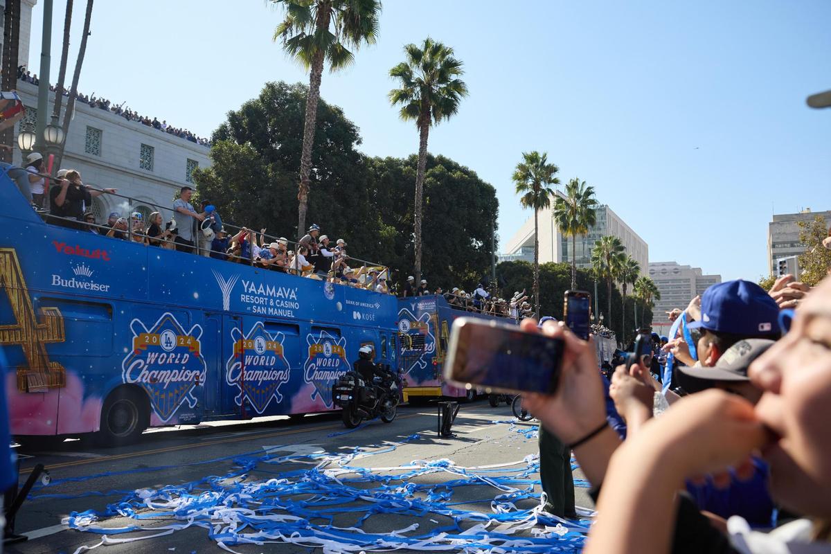 Fans cheer as the Los Angeles Dodgers celebrate their World Series victory with a parade in Los Angeles, California, USA, 01 November 2024.